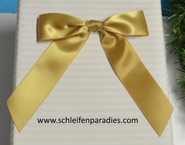 Elegante goldfarbige Satinschleife für Geschenk und Christbaum
